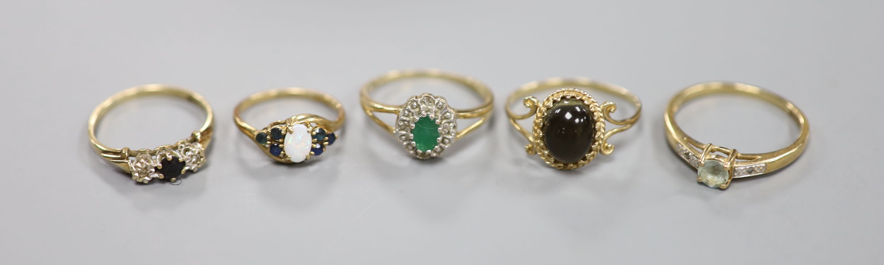 Five assorted modern 9ct gold and gem set rings